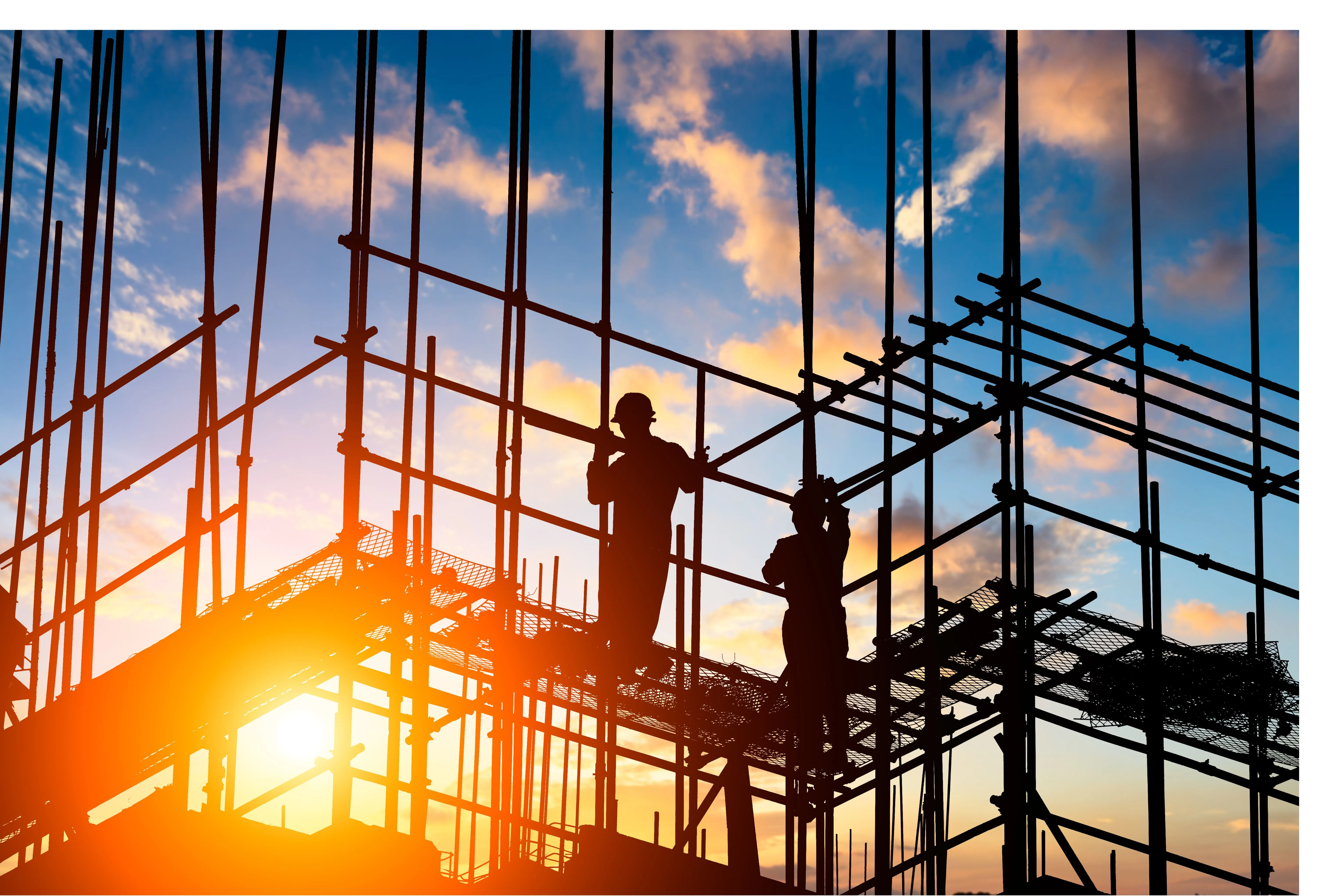 Construction workers at sunset